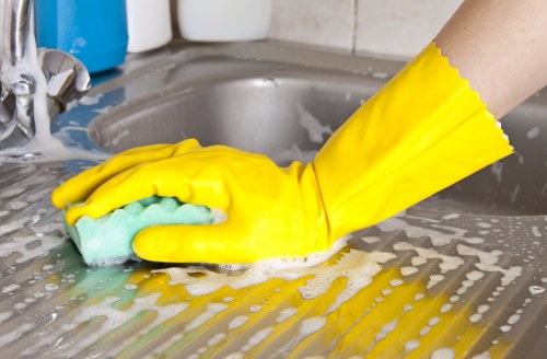 Technician performing upholstery cleaning on a fabric chair